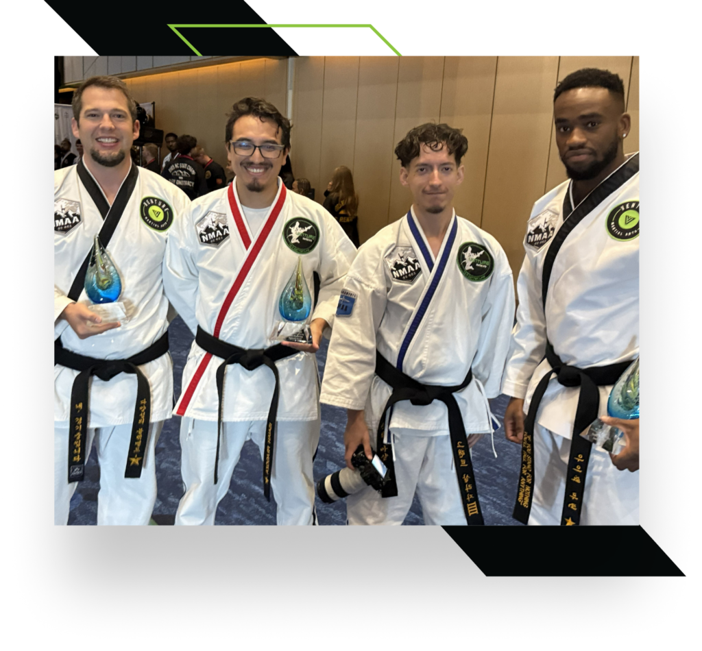 Martial arts programs award winners celebrating their achievements.